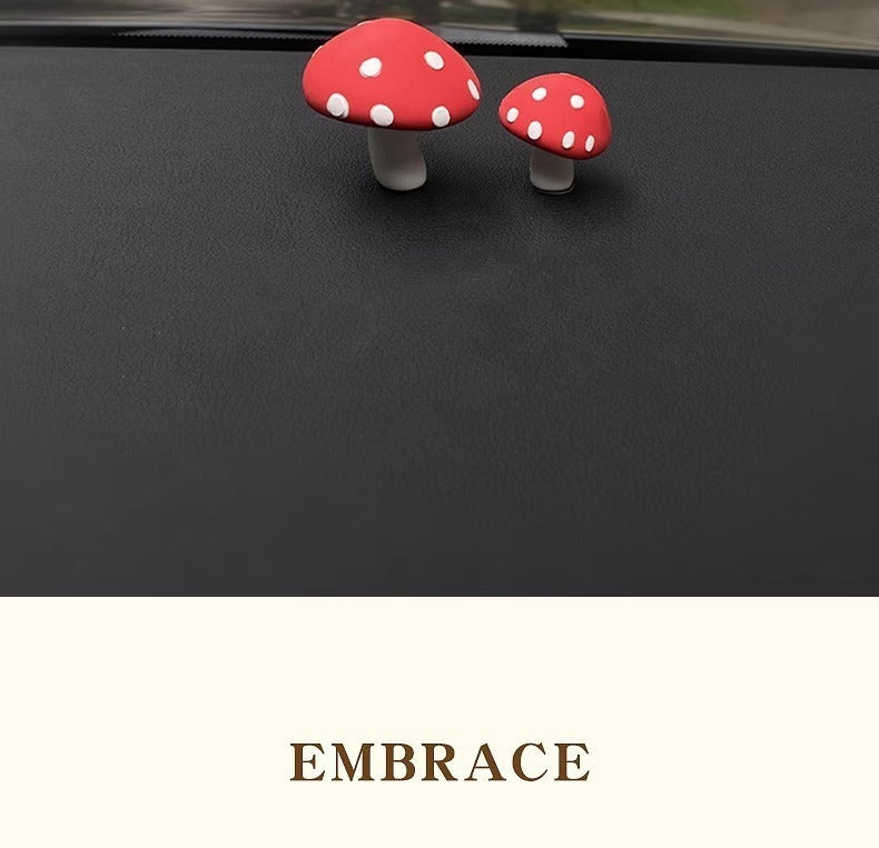 Red mushrooms, one big and one small