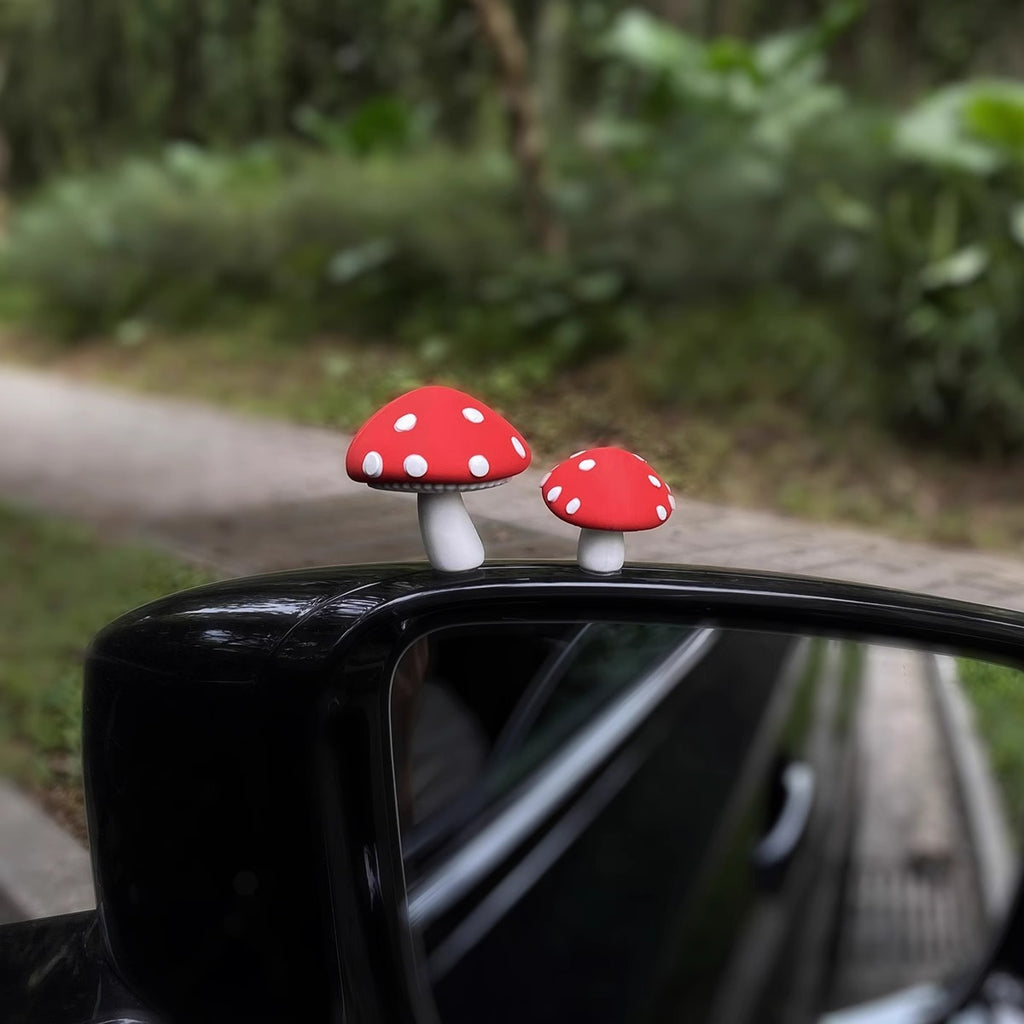 Red mushrooms, one big and one small