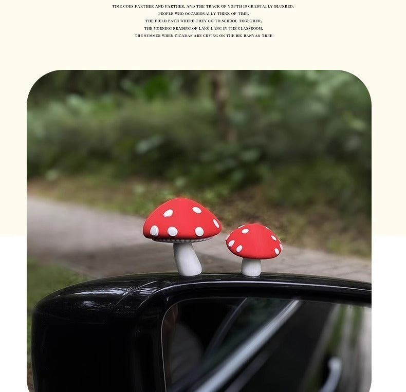 Red mushrooms, one big and one small